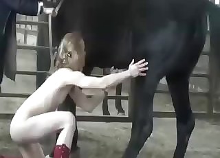 Pale blonde zoophile blows a horse