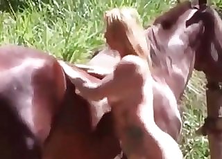 Incredible blonde cockslut really loves having sex with a brown stallion